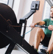 Man using rowing machine - one of The Most Underrated Gym Equipment You’re Probably Not Using