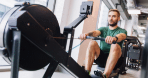 Man using rowing machine - one of The Most Underrated Gym Equipment You’re Probably Not Using